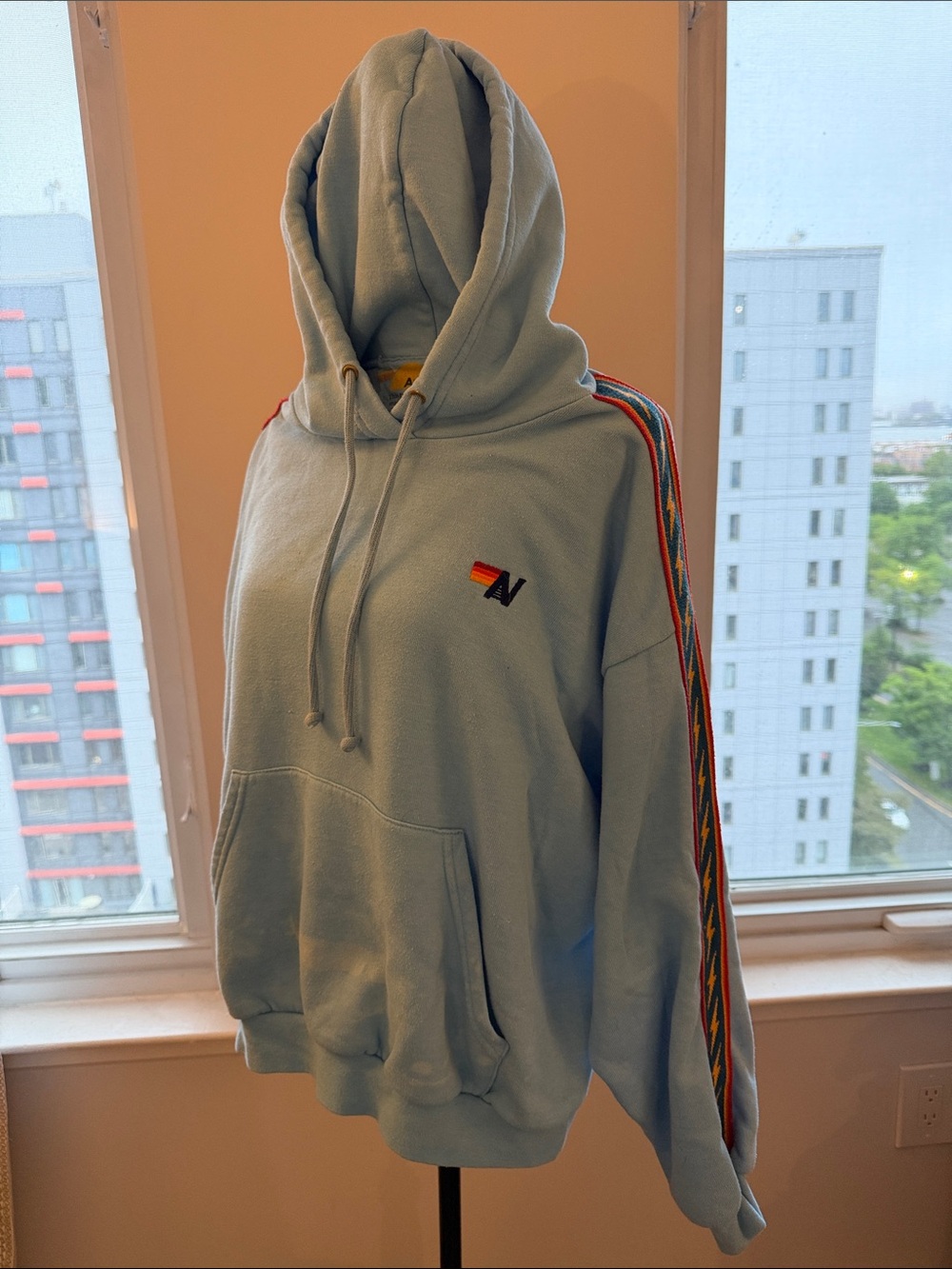 Aviator Nation Light Blue Hoodie with Rainbow Sleeve Stripes